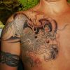 chest asian dragon tattoo